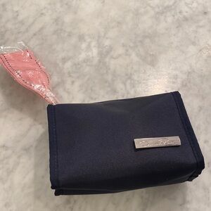 New No tag Oscar De La Renta small cosmetic case navy blue with pink ribbon